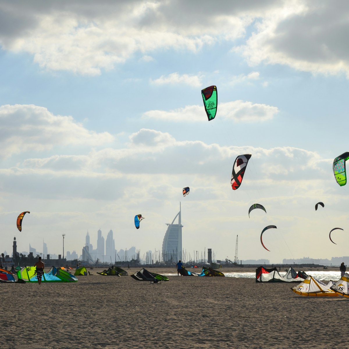 11/30/2014. Kite beach in Jumeirah, Dubai, United Arab Emirates. A stretch of the beach designated for the kite surfers. The iconic Burj Al Arab is seen on the background.; Shutterstock ID 664989337; Your name (First / Last): Lauren Keith; GL account no.: 65050; Netsuite department name: Online Editorial; Full Product or Project name including edition: Authentic Dubai Article